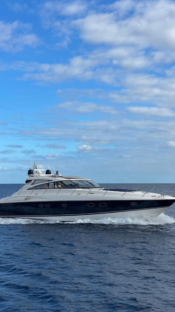 A Luxury Madeira Yacht Charter Rental in the sea of Madeira enjoying the view of the PortoSanto syline, an experience by Luxury Charter Madeira.
