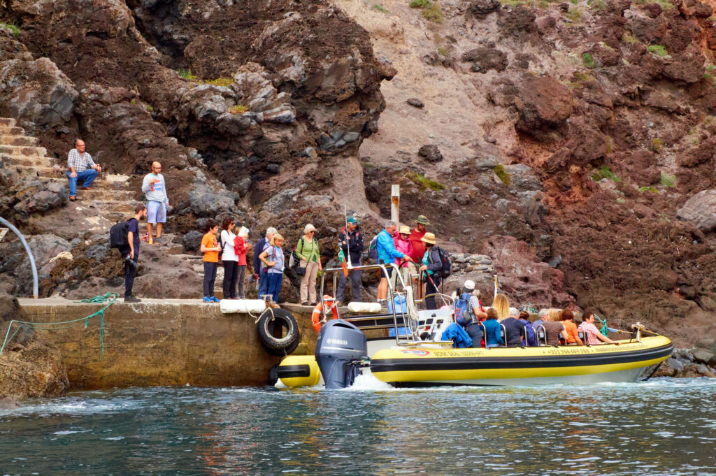 PR8 Madeira: The Vereda da Ponta de São Lourenço Walking Guide 4 People boarding the boat at Cais do Sardinha and about to start a tour with Madeira Sea Emotions.