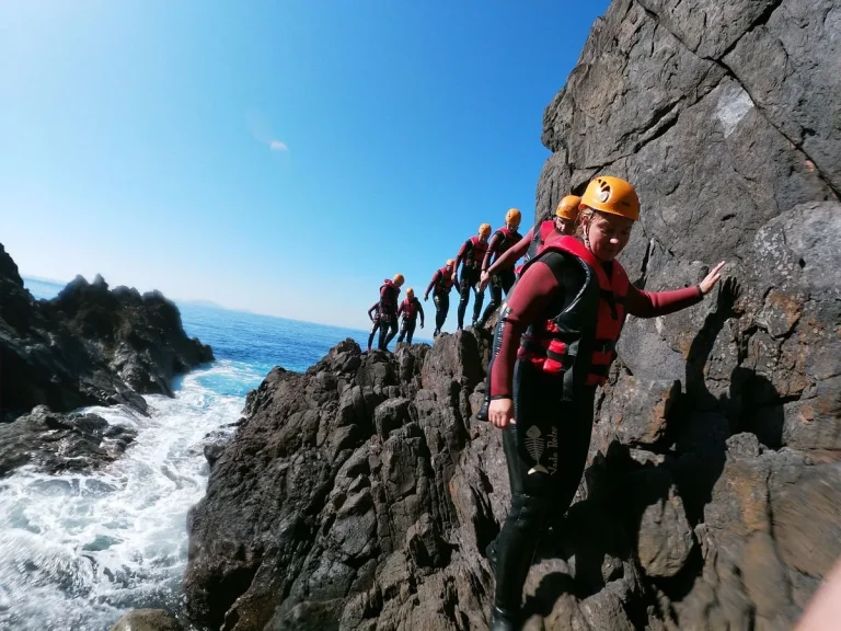 Coasteering along Madeira's volcanic coastline at Baía d'Abra