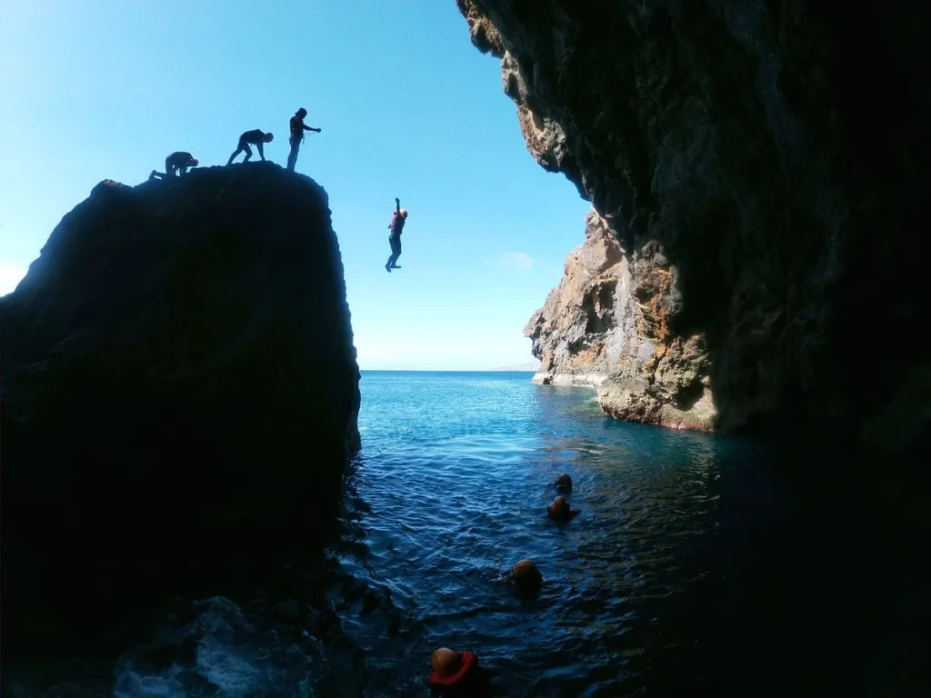 Coasteering with Discovery Island Madeira at Baía d'Abra — guided cliff jump into the Atlantic