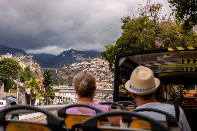 People on the top of the bus in Funchal a Hop-on Hop-off Bus experience by Carristur