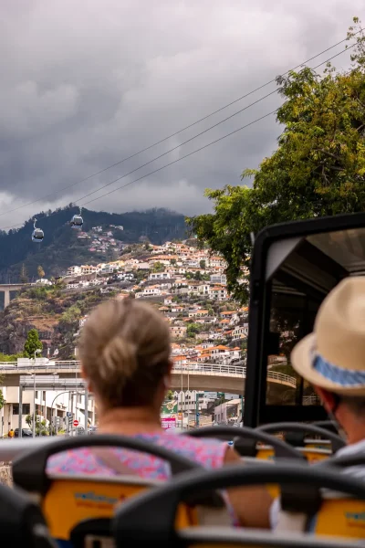 People on the top of the bus in Funchal a Hop-on Hop-off Bus experience by Carristur