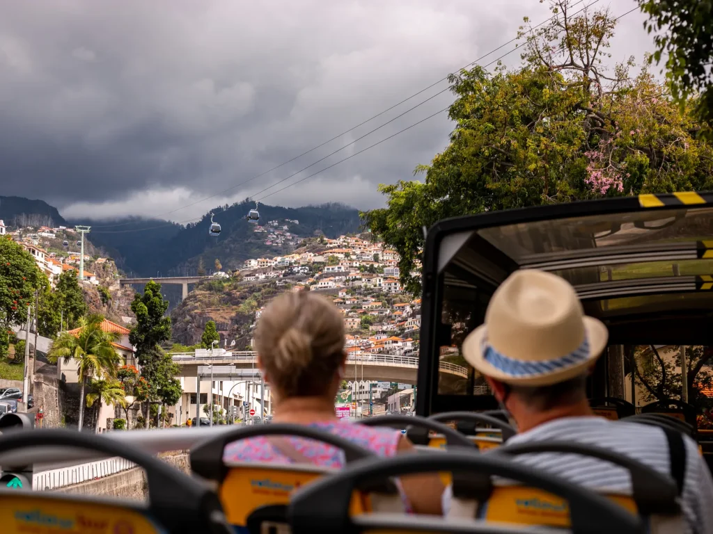 People on the top of the bus in Funchal a Hop-on Hop-off Bus experience by Carristur