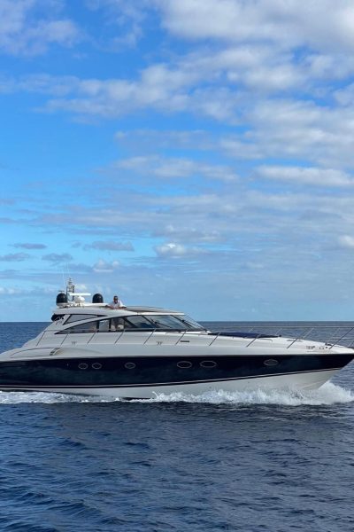 A Luxury Madeira Yacht Charter Rental in the sea of Madeira enjoying the view of the PortoSanto syline, an experience by Luxury Charter Madeira.
