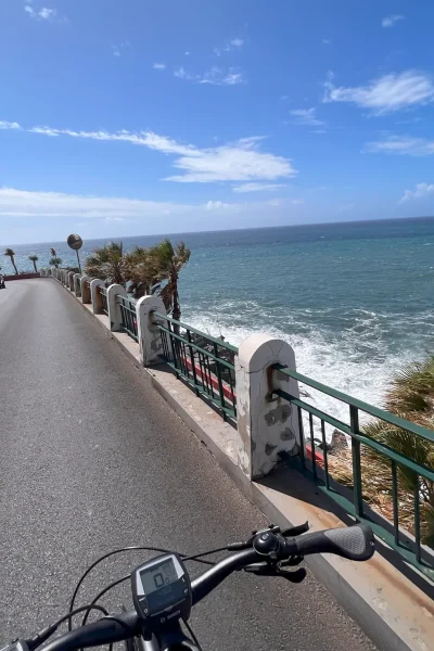 E-bike rider following a scenic coastal road on Madeira during the E-Bike Road Tour with Cabo Girão, an experience by MADcycle.