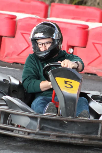 A men with glasses making a durn in a karting race, under Madeira Airport, an experience by Go Kart Madeira