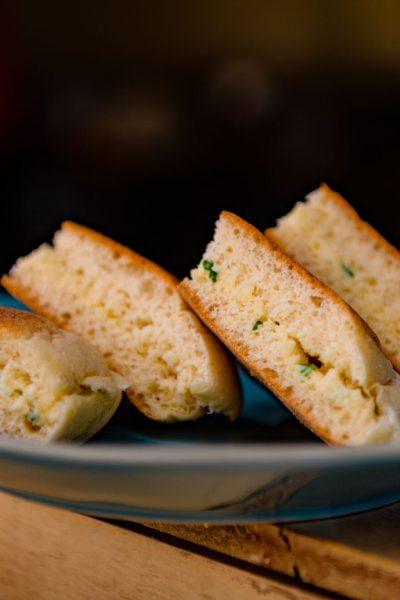 Bolo do caco on a blue plate,a true taste of Madeira, brought to you by Madeira Sea Emotions.