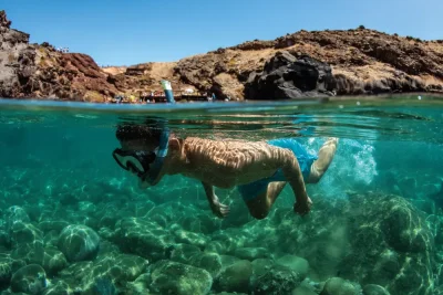 A man Snorkelling in the sea of Ponta de São Lourenço, an experience by Madeira Sea Emotions.