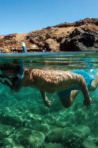 A man Snorkelling in the sea of Ponta de São Lourenço, an experience by Madeira Sea Emotions.