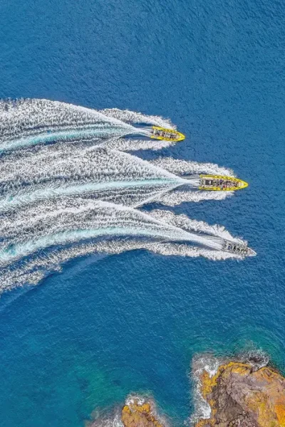 Top view of 3 boats on the coast of Ponta São Lourenço an experience by Madeira Sea Emotions