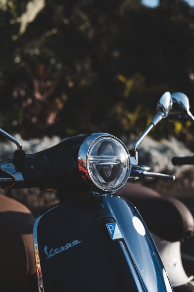 Close up of a Vespa Primavera/GTS 125cc model, the type offered for rent to explore the Madeira island’s winding mountain roads and scenic viewpoints by Vespa Madeira Scooter Rent.